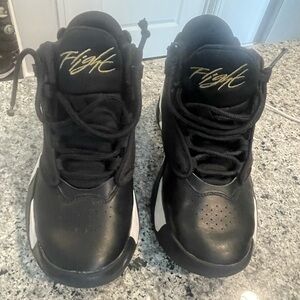 Air Jordan Nike Black and White with gold. Flight Sneakers.